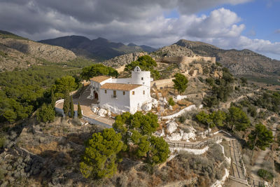 Aerial view of hermitage of  la magdalena with some clouds and blue sky