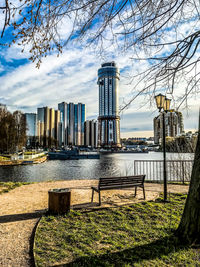 River and buildings against sky