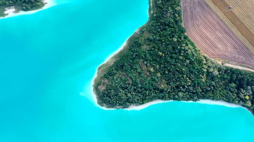 High angle view of rocks on sea shore