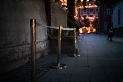 Illuminated lamp in city at night