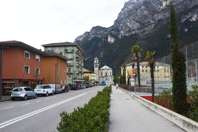 Vehicles on road along buildings