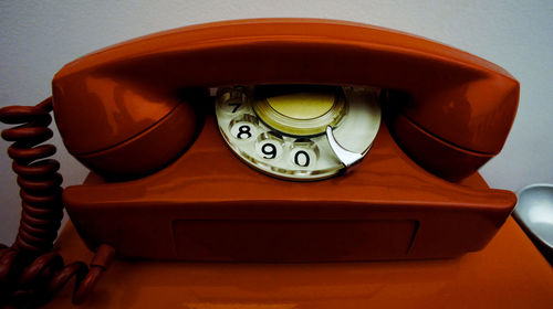 Close-up of telephone on table