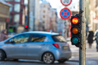 Traffic signal on road in city