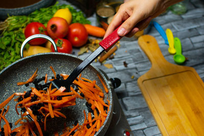 Cropped hand of person preparing food