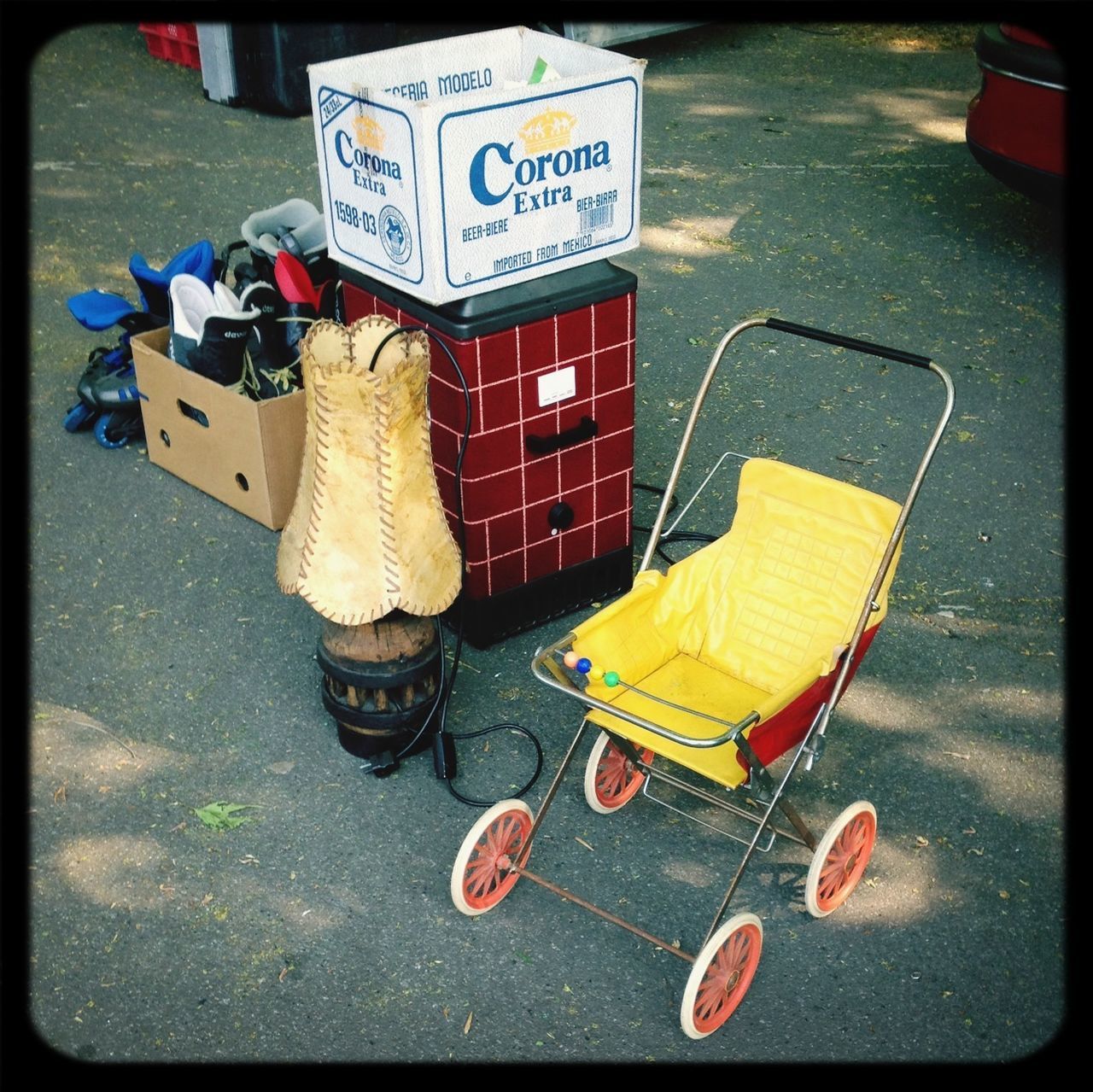 transfer print, street, auto post production filter, high angle view, text, transportation, outdoors, western script, day, yellow, road, communication, sidewalk, car, garbage, sign, absence, no people, guidance, large group of objects