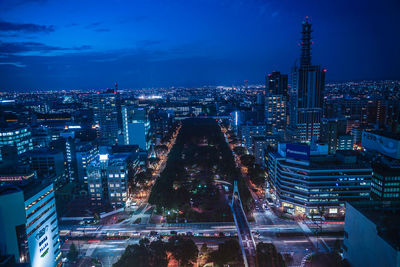 Aerial view of illuminated city buildings at night