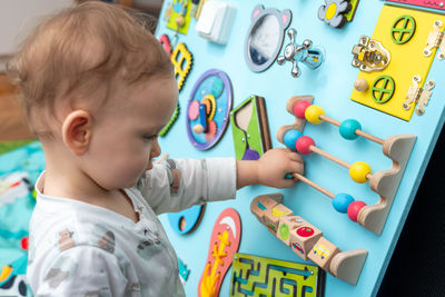 Close-up of boy playing with toys