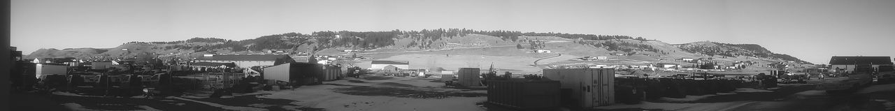 High angle view of buildings and street against sky