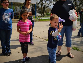 Full length of friends standing outdoors