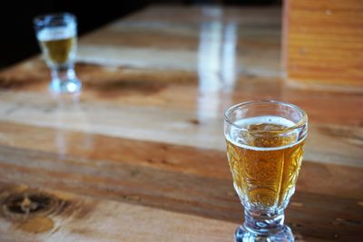 Close-up of beer glass on table