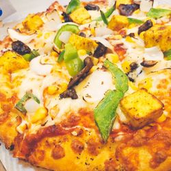 Close-up of pizza served in plate