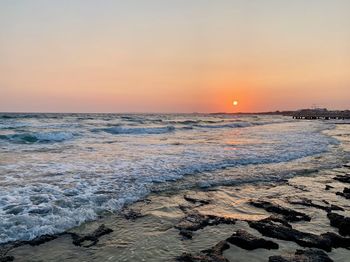 Scenic view of sea against sky during sunset