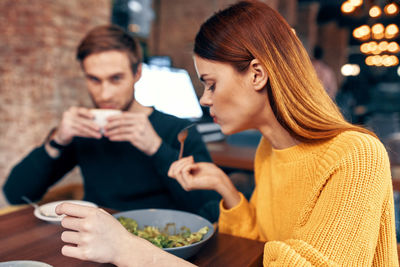 Couple having food at restaurant