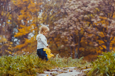 Side view of a boy in autumn