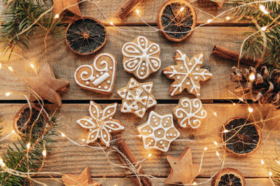 Overhead photo of gingerbread christmas cookies on wooden boards