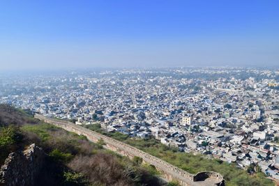 Aerial view of cityscape against sky