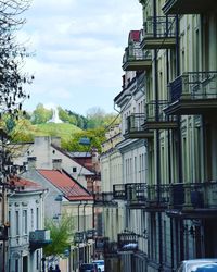 Residential buildings against sky in city