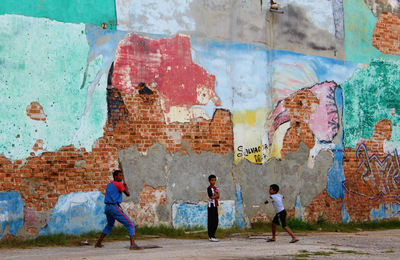 Group of people on wall