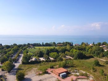 High angle view of trees and buildings against sky