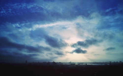 Cloudy sky over cityscape