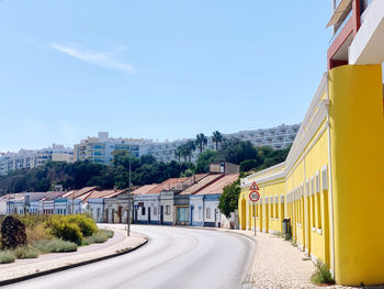 Buildings in city against sky