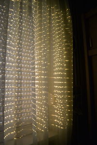 Close-up of illuminated curtain at home