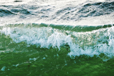 Close-up of waves rushing towards shore