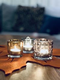 Close-up of tea light candles on table