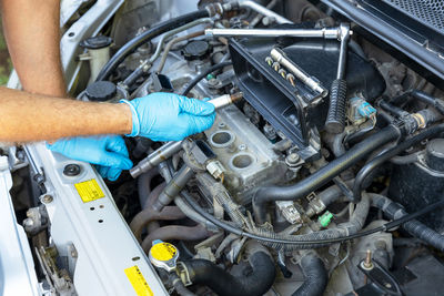 Misfiring car spark plug replacement. repairing of vehicle.