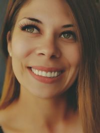 Close-up portrait of a smiling young woman