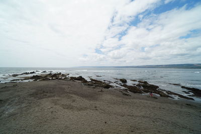 Scenic view of beach against sky