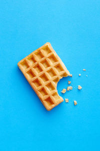 Directly above shot of cake against blue background