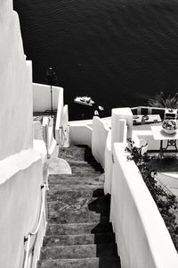 High angle view of steps by swimming pool against sea