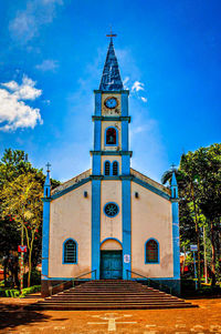 View of clock tower against blue sky