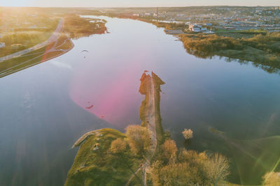 Scenic view of lake at sunset