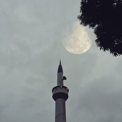 Low angle view of bell tower against sky