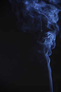 Close-up of smoke against black background