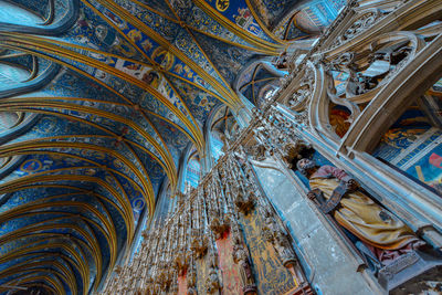 Low angle view of ornate ceiling in abandoned building