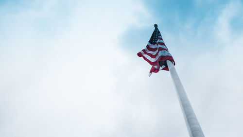 Low angle view of flag against sky