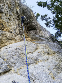 Low angle view of ropes on rock