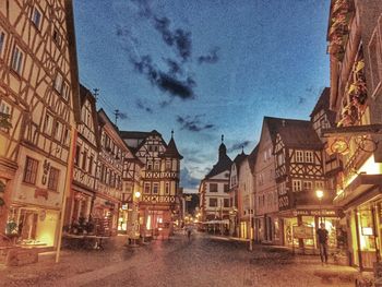 Illuminated buildings in city at night