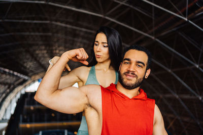 Man and woman strengthen hands at fitness training