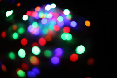 Defocused image of illuminated lights at night