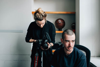 Young couple looking at camera