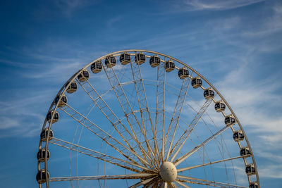 Low angle view of ferris wheel against sky