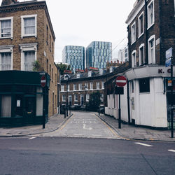Street in city against clear sky
