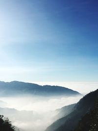 Scenic view of mountains against clear blue sky