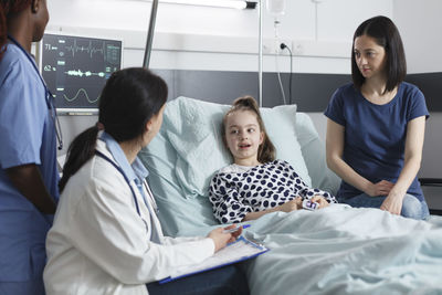 Doctor examining patient in clinic