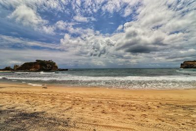 Scenic view of beach against sky