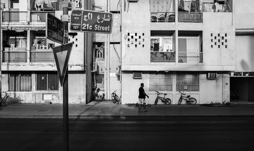 Man walking on street in city